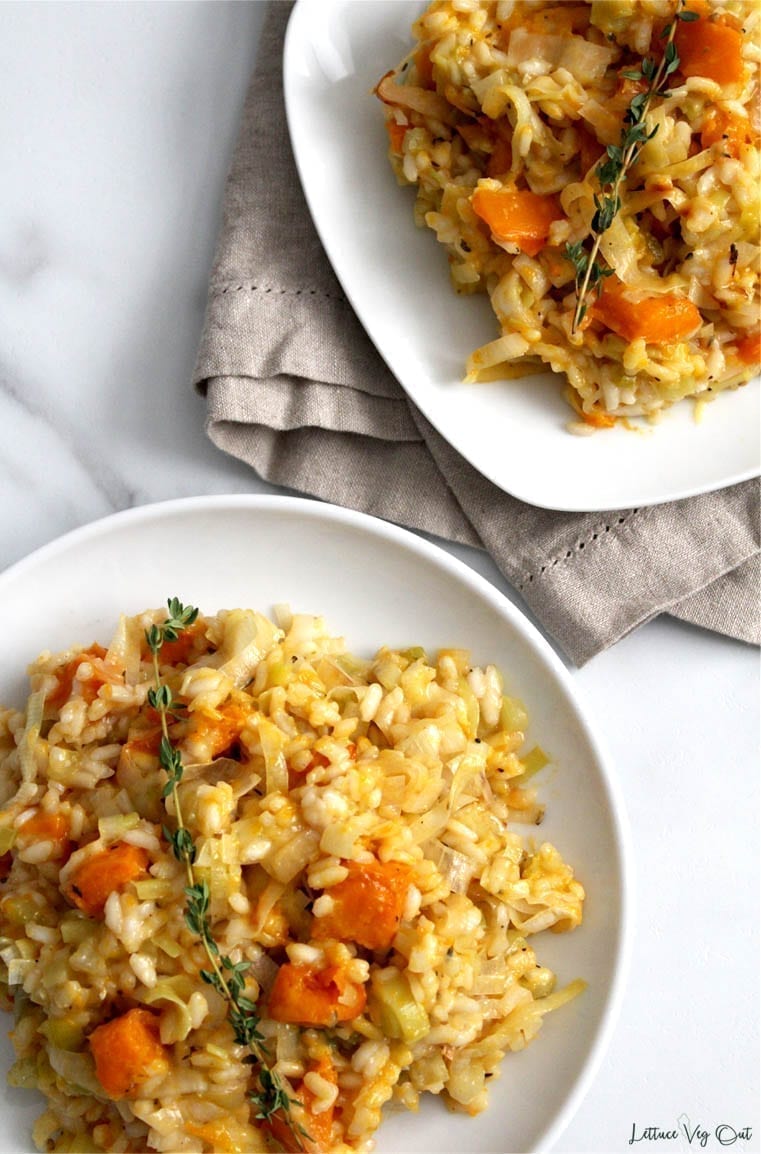 Two plates of leek pumpkin risotto with vegan ingredients