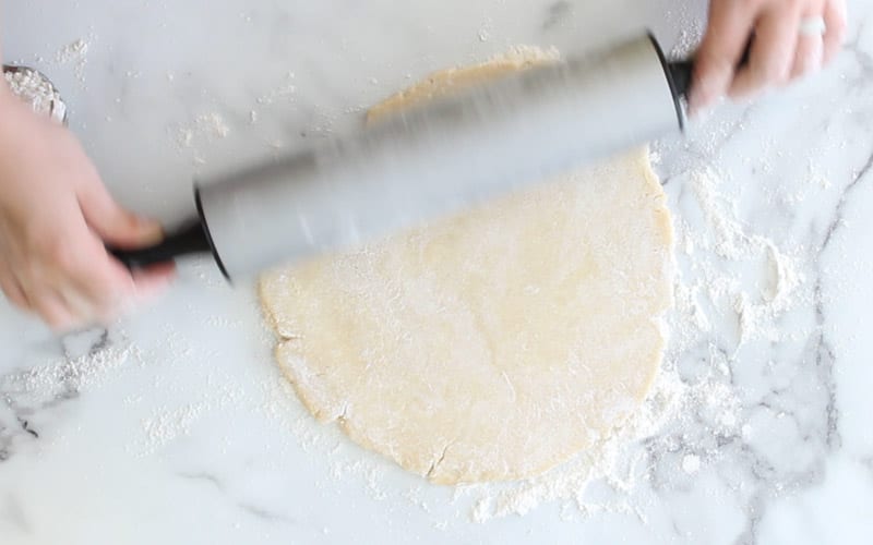 Image showing how to roll vegan eggless pie shell without sticking or cracking the shortcrust pastry