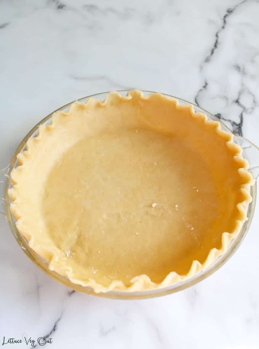 Image of vegan shortcrust pastry, unbaked and still in dough form; ready to put in the oven