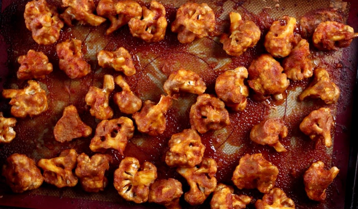Baked BBQ cauliflower wings on baking tray.