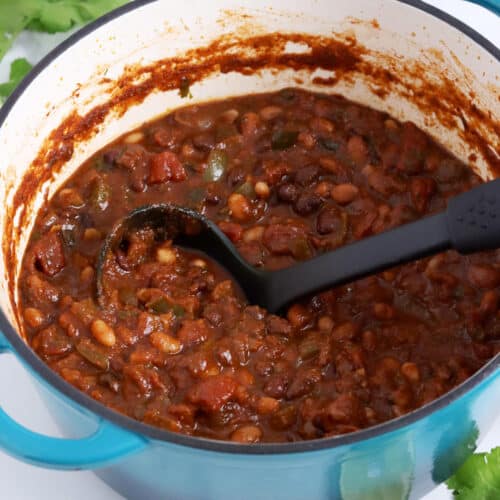 Close up of a blue pot filled with bean chili.