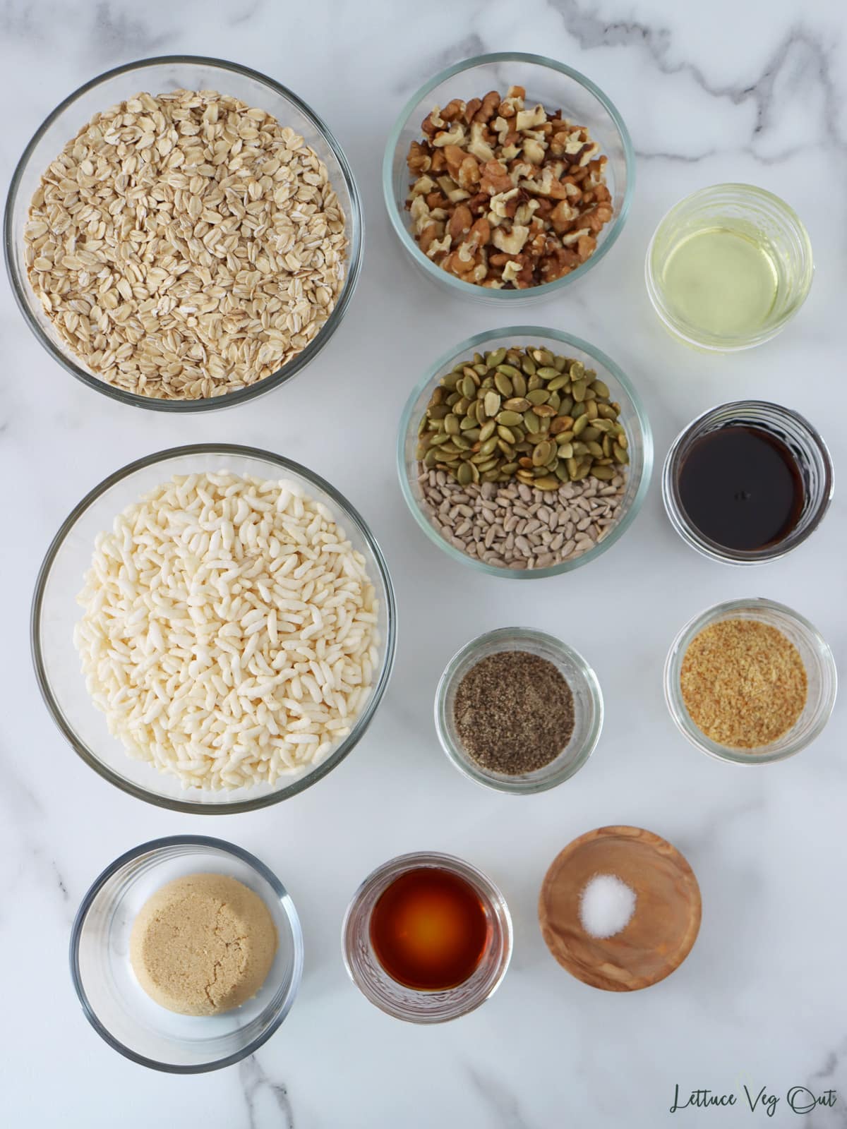 Small glass dishes with ingredients for puffed rice granola.
