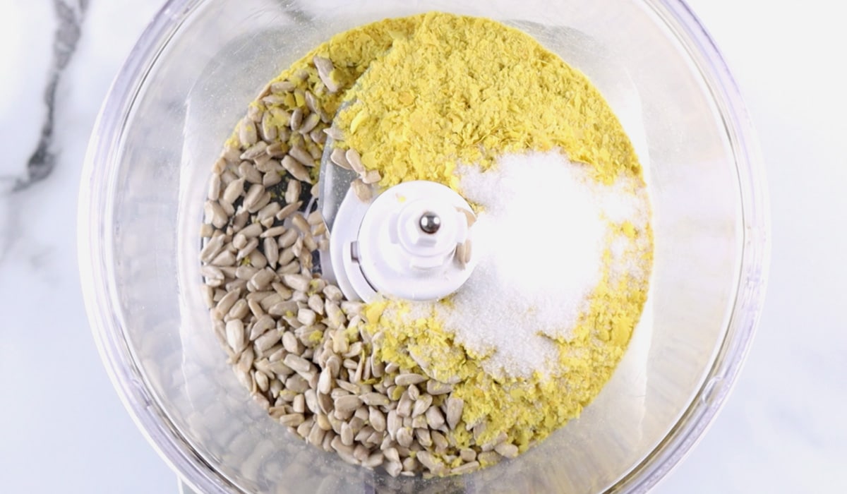 Ingredients for sunflower parmesan in a food processor.